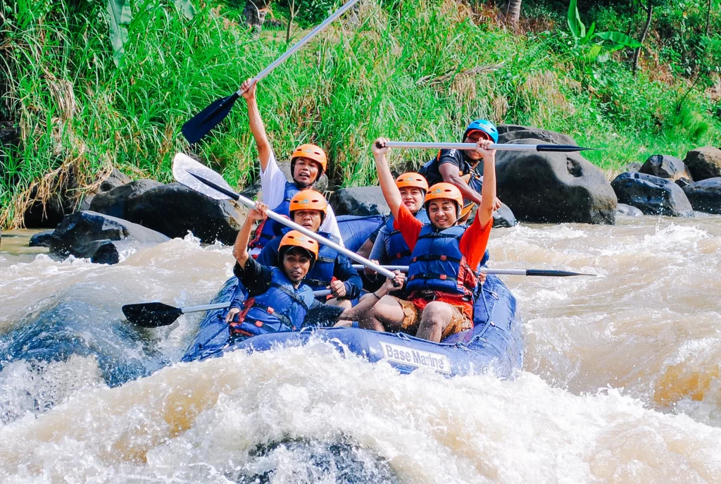 A group rafting down a churning river in Bali